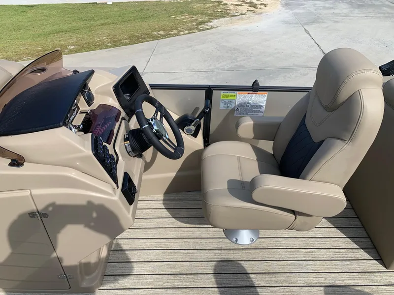 Slide: The Image of Interior of a 2021 Starcraft SLS 3 boat with helm console and seat. - 8