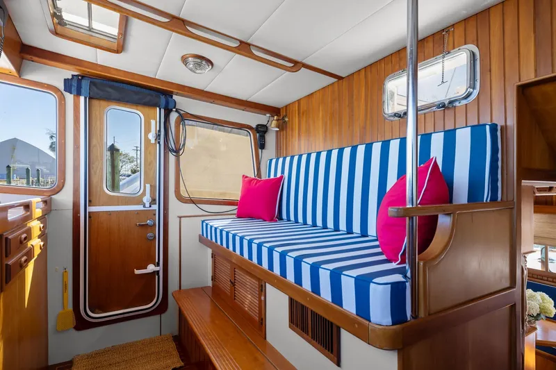 Slide: The Image of Interior of 1999 Kadey-Krogen 39 with striped seating and vibrant cushions. - 14