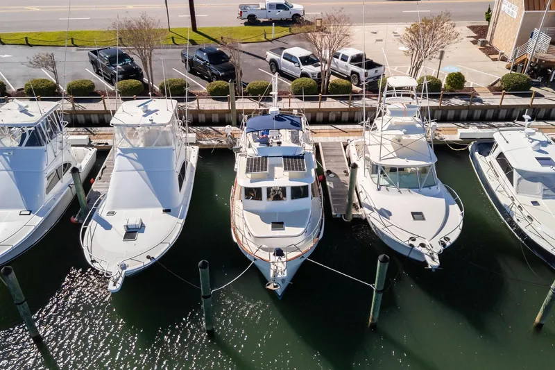 Slide: The Image of Docked 1999 Kadey-Krogen 39 yacht among other boats in a marina. - 2