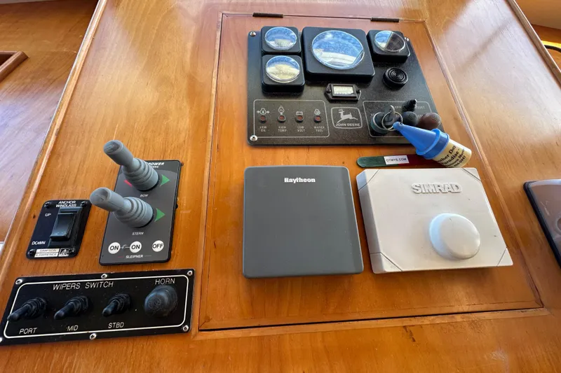 Slide: The Image of Control panel of a 1999 Kadey-Krogen 39 boat with navigation instruments. - 21