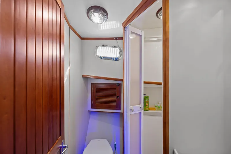 Slide: The Image of Bathroom interior of 1999 Kadey-Krogen 39 yacht with wooden accents and modern fixtures. - 30