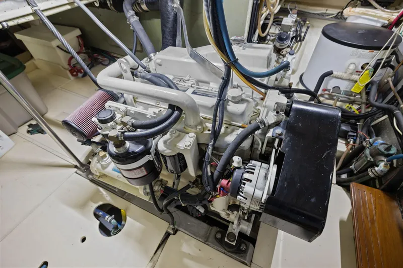 Slide: The Image of Engine room of a 1999 Kadey-Krogen 39 yacht, showcasing detailed machinery components. - 33