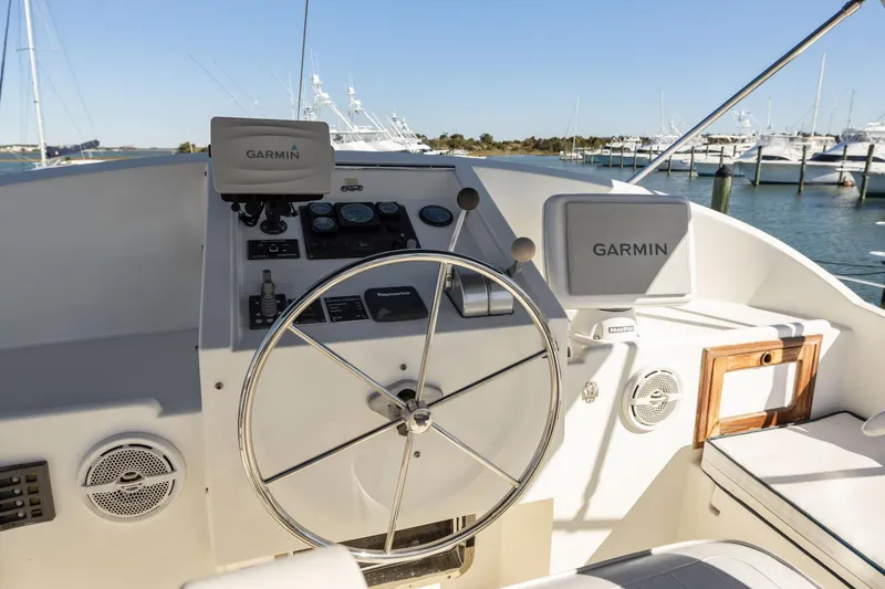 Slide: The Image of Helm of 1999 Kadey-Krogen 39 yacht with Garmin navigation systems. - 43