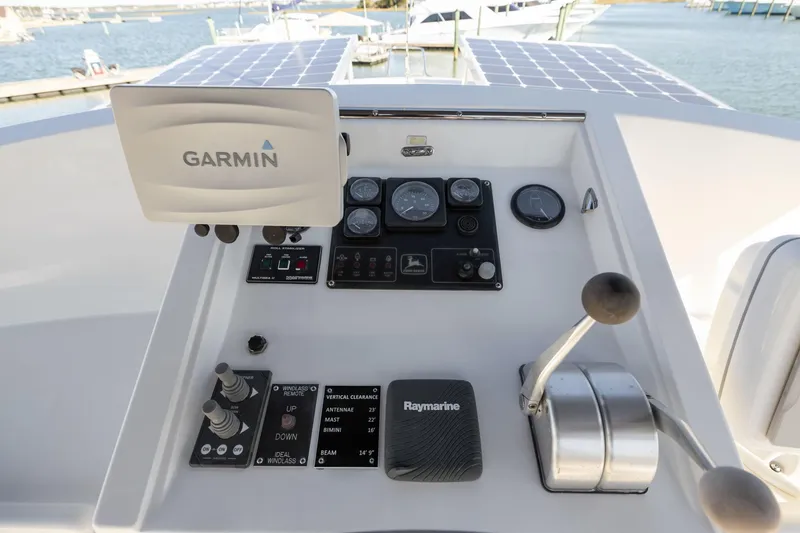 Slide: The Image of Kadey-Krogen 39 (1999) helm with Garmin and Raymarine navigation systems. - 44