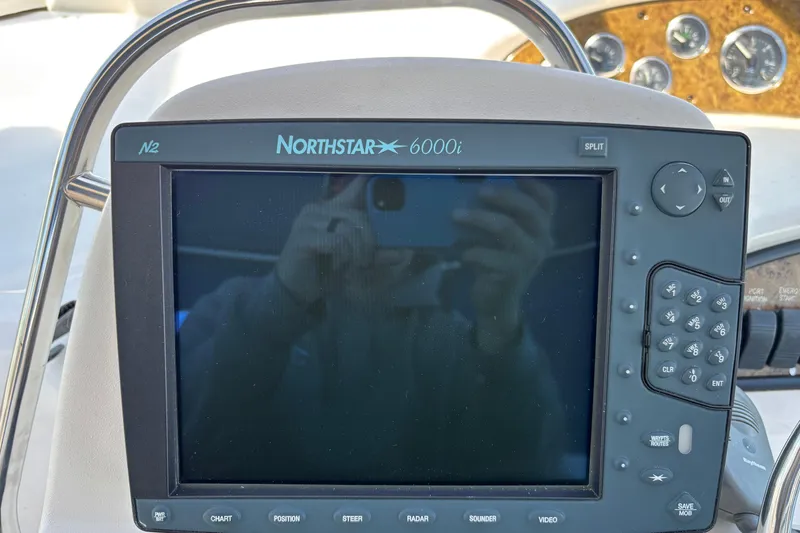 Slide: The Image of Northstar 6000i navigation system on 2000 Sea Ray 340 Sundancer boat dashboard. - 16