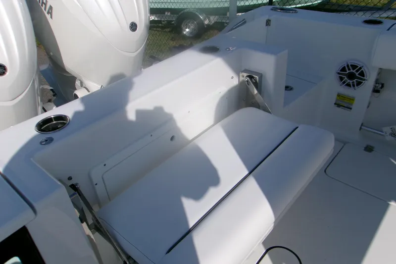 Slide: The Image of 2026 Sportsman Open 252 Center Console boat interior with seating and engine details. - 10