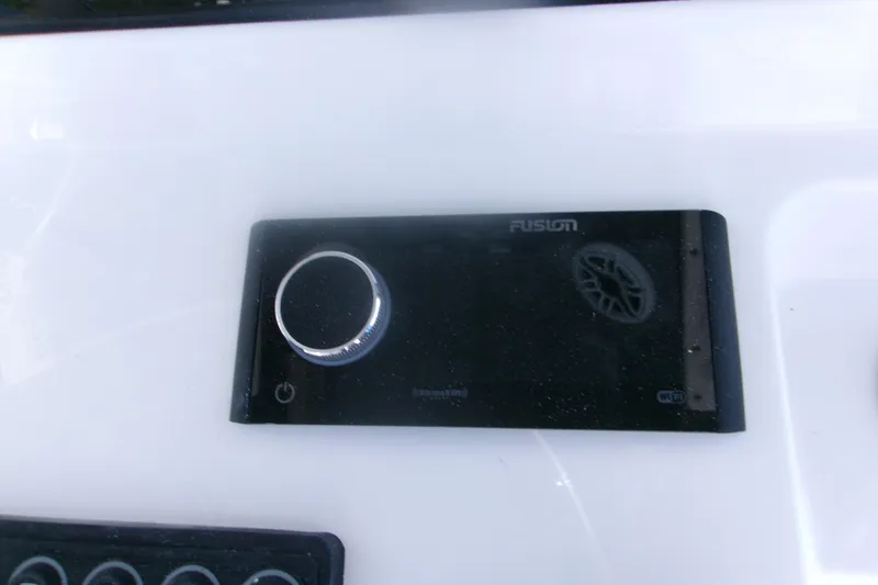 Slide: The Image of Fusion audio system on 2026 Sportsman Open 252 Center Console boat dashboard. - 13