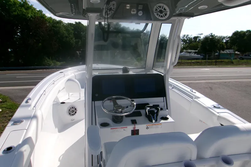Slide: The Image of 2026 Sportsman Open 252 Center Console boat interior with steering wheel and dashboard. - 6