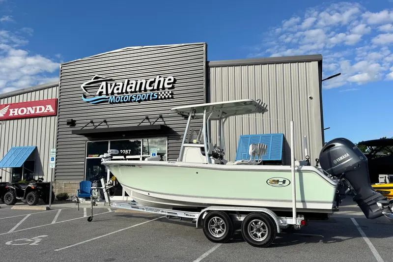 The Image of 2016 Sea Hunt Ultra 211 boat on trailer at Avalanche Motorsports dealership. - 0