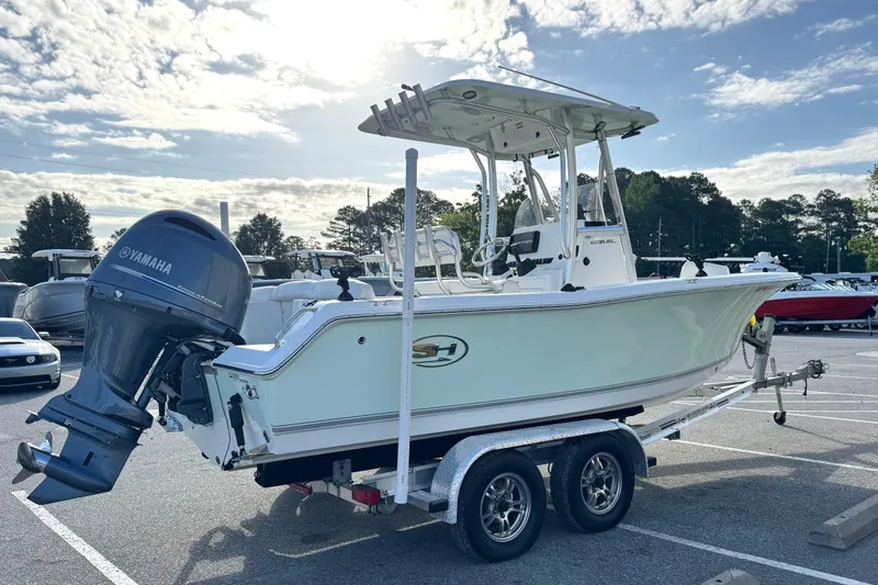 Slide: The Image of 2016 Sea Hunt Ultra 211 boat on trailer with Yamaha outboard motor. - 3