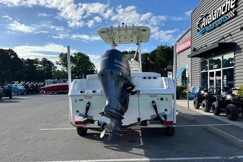 Slide: The Image of 2016 Sea Hunt Ultra 211 boat with Yamaha engine at dealership parking lot. - 4