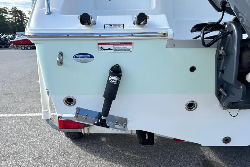 Slide: The Image of Rear view of a 2016 Sea Hunt Ultra 211 boat with Lenco trim tab. - 6