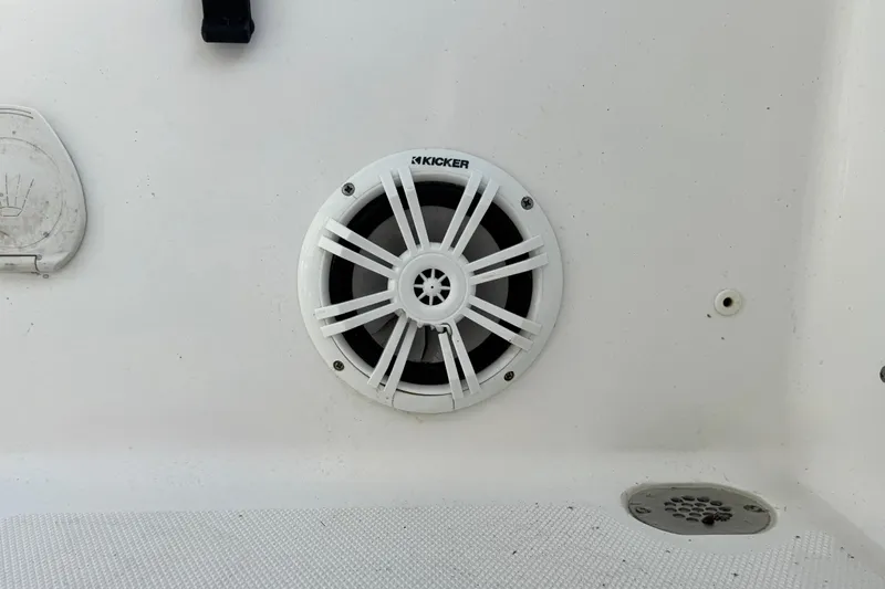 Slide: The Image of Kicker speaker on 2016 Sea Hunt Ultra 211 boat, white interior detail. - 7