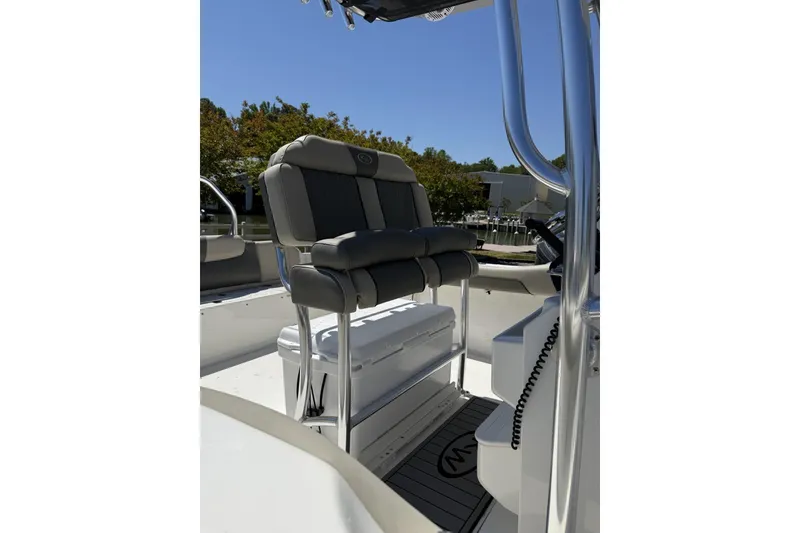 Slide: The Image of 2026 Key West 239 FS boat interior with cushioned seating and console. - 3