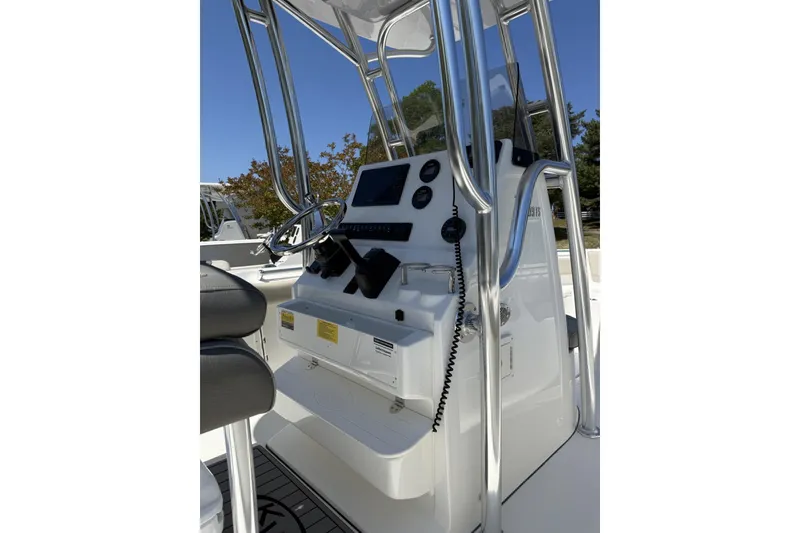 Slide: The Image of 2026 Key West 239 FS boat console with steering wheel and controls. - 4