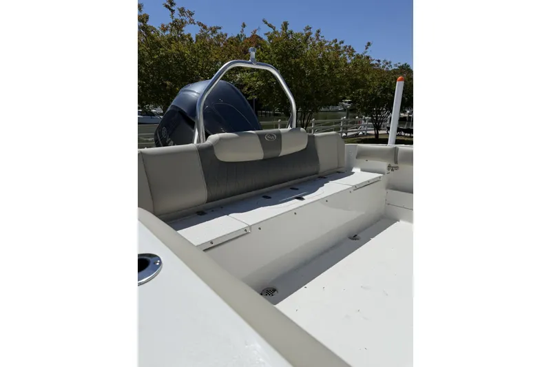 Slide: The Image of 2026 Key West 239 FS boat interior with seating and engine view. - 5