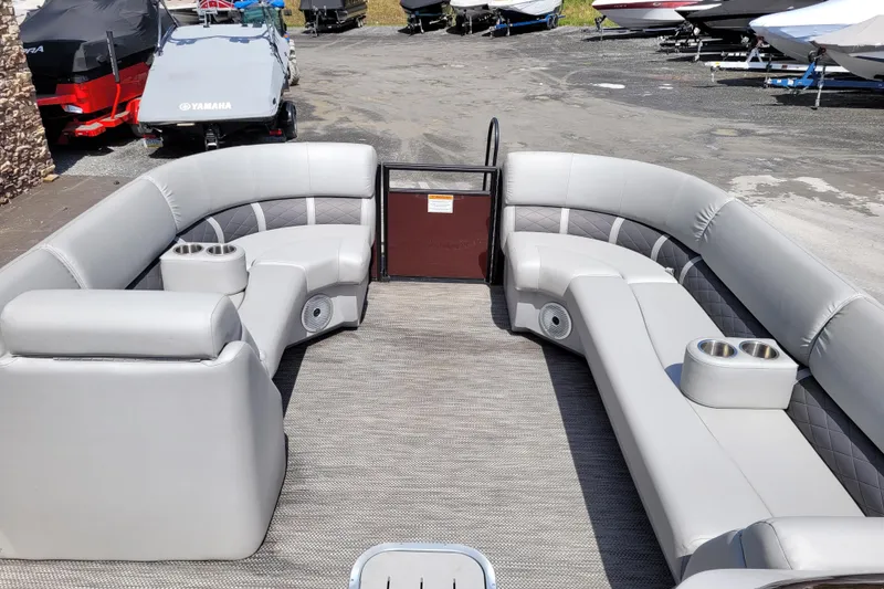 Slide: The Image of 2021 Bennington 24 SSBX pontoon boat interior with plush seating and cup holders. - 10