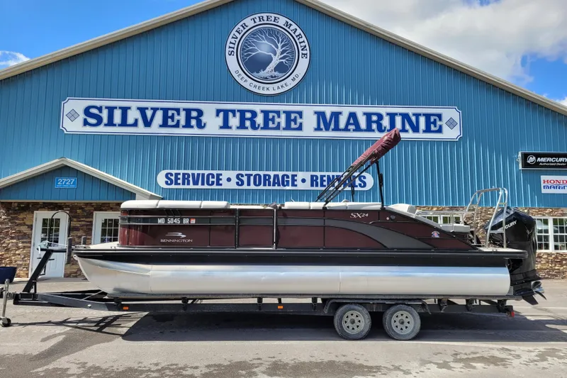 Slide: The Image of 2021 Bennington 24 SSBX pontoon boat at Silver Tree Marine dealership. - 5