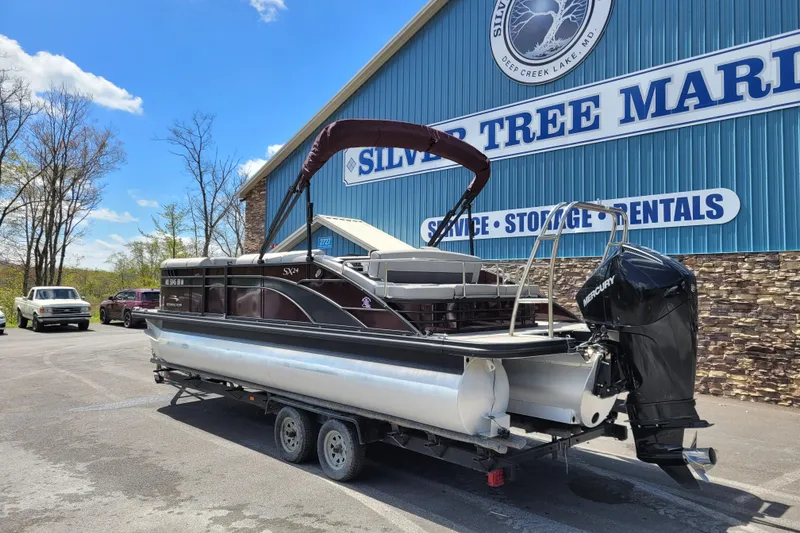 Slide: The Image of 2021 Bennington 24 SSBX pontoon boat on trailer at Silver Tree Marine. - 6
