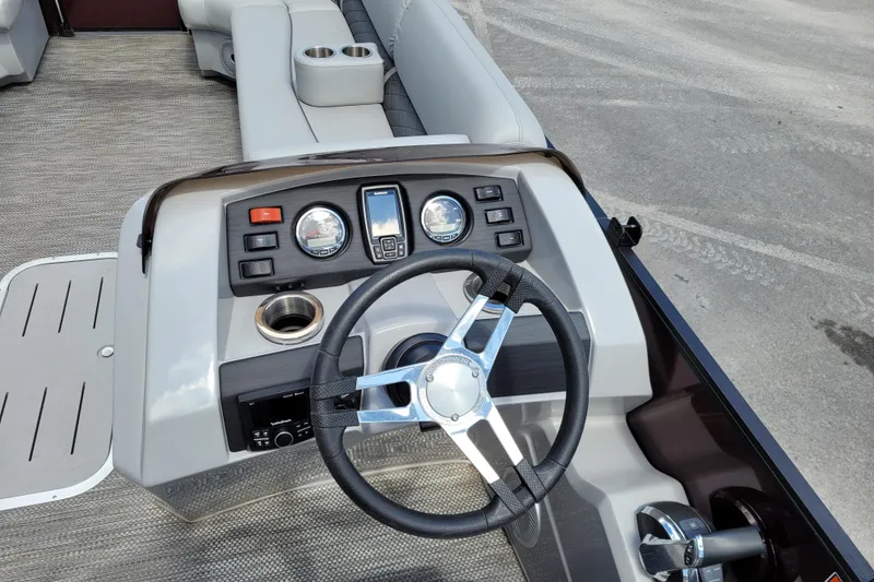 Slide: The Image of 2021 Bennington 24 SSBX boat dashboard with steering wheel and control panel. - 9