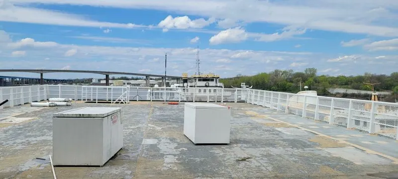 Slide: The Image of Empty deck of 1981 Custom Victory 11 ship with scenic river view. - 18