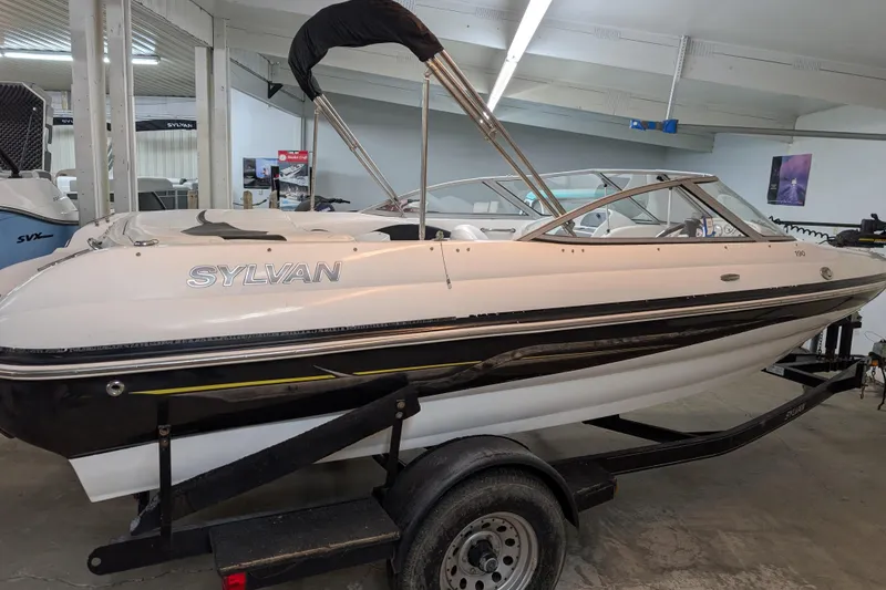 Slide: The Image of 2005 Sylvan V190 I/O boat on trailer in indoor showroom. - 2