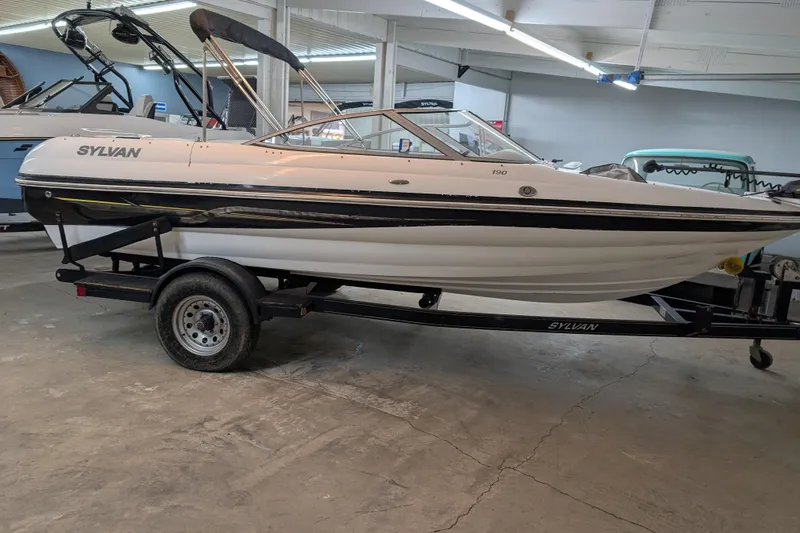 Slide: The Image of 2005 Sylvan V190 I/O boat on trailer in indoor showroom. - 9