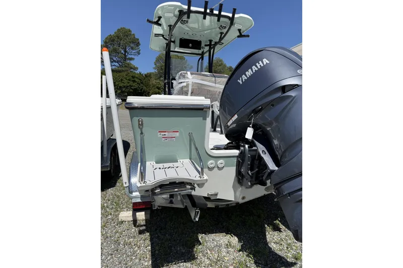 Slide: The Image of 2026 Parker 230 Coastal Elite boat with Yamaha outboard motor, rear view. - 6