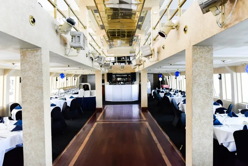 Slide: The Image of Luxurious dining area on Blount 130 Dinner Cruise, 1979, with elegant table settings and decor. - 21