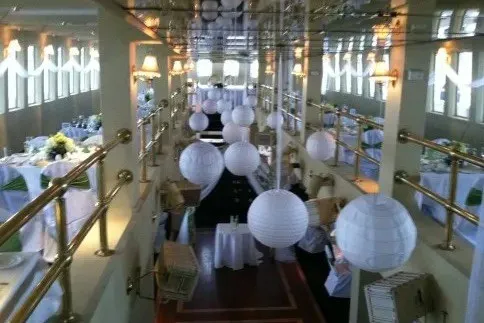 Slide: The Image of Elegant interior of Blount 130 Dinner Cruise ship, 1979, with white lanterns and decorated tables. - 13