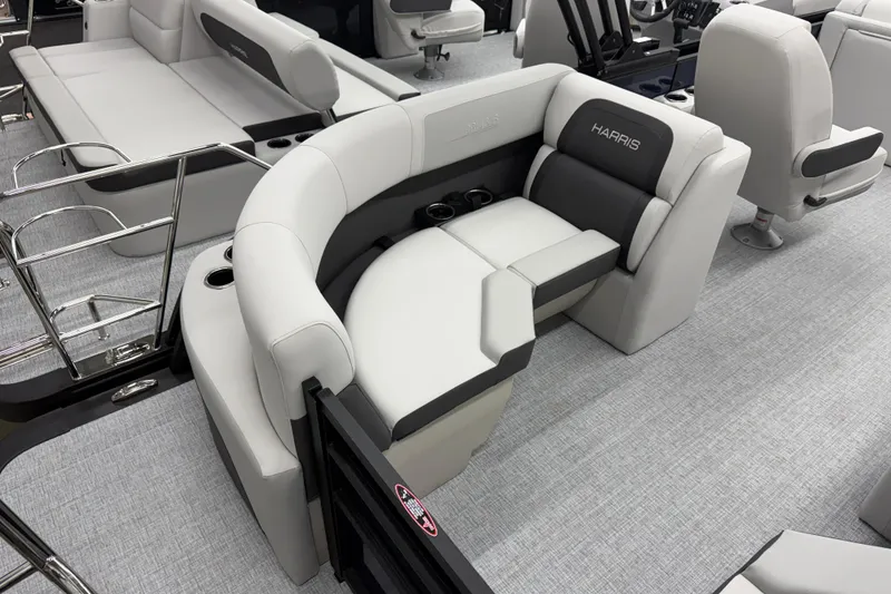 Slide: The Image of 2026 Harris Cruiser 210 CWDH boat interior with plush seating and modern design. - 13