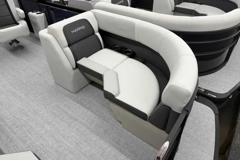 Slide: The Image of Luxurious seating on the 2026 Harris Cruiser 210 CWDH pontoon boat, featuring elegant upholstery. - 3
