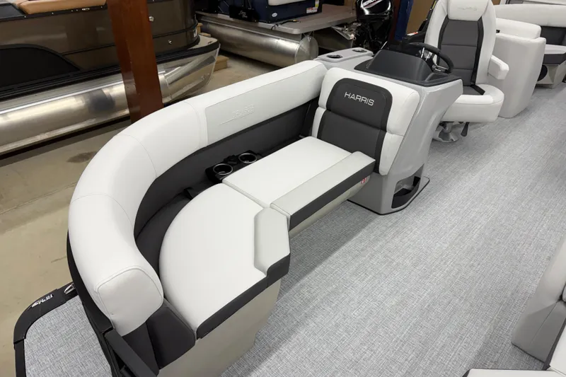 Slide: The Image of 2026 Harris Cruiser 210 CWDH pontoon boat interior with plush seating and modern design. - 4