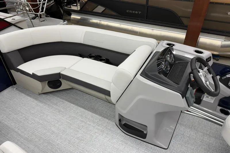 Slide: The Image of 2026 Harris Cruiser 210 CWDH boat interior with plush seating and modern helm. - 6