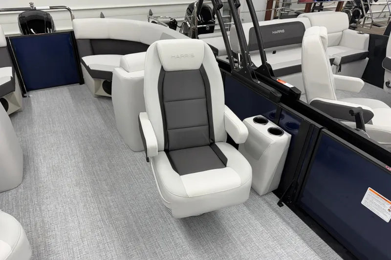 Slide: The Image of 2026 Harris Cruiser 210 CWDH boat interior with plush seating and modern design. - 8