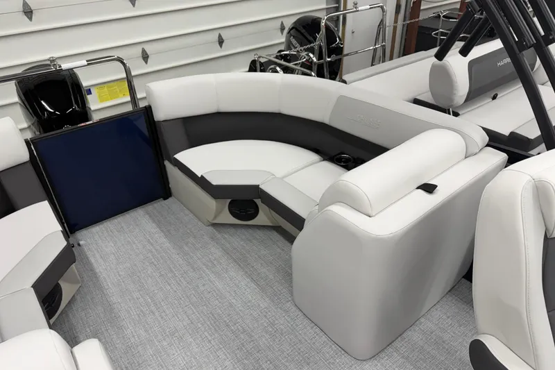 Slide: The Image of 2026 Harris Cruiser 210 CWDH pontoon boat interior with plush seating and modern design. - 9