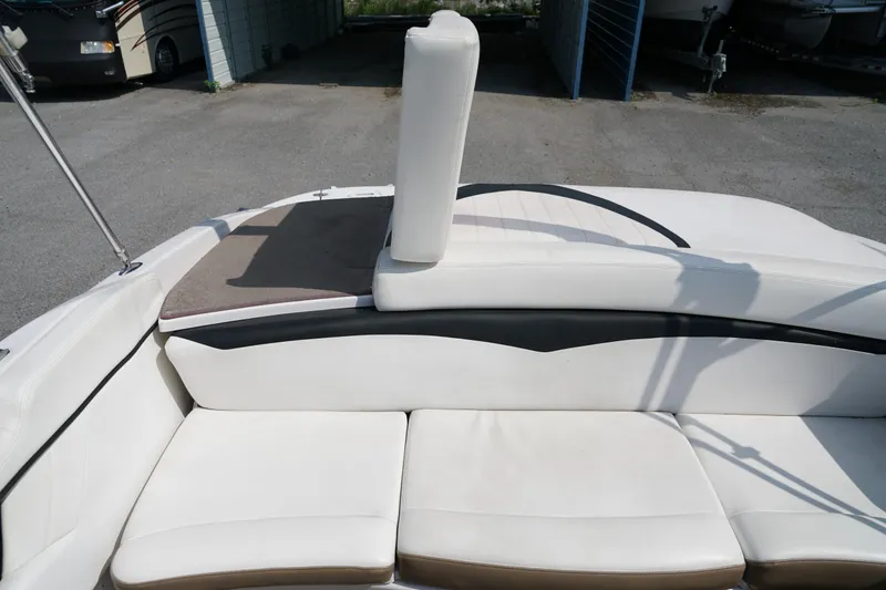 Slide: The Image of 2007 Four Winns 210 Horizon boat interior with white seating and sun pad. - 13