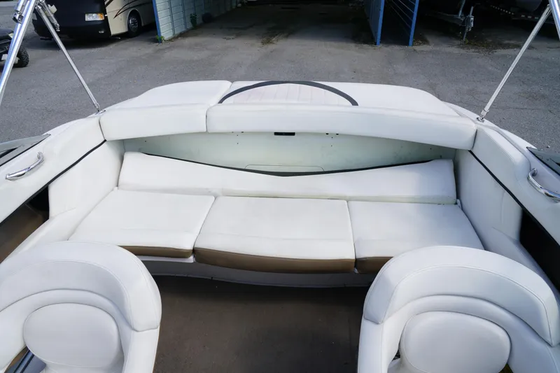 Slide: The Image of 2007 Four Winns 210 Horizon boat interior with white seating and spacious layout. - 14