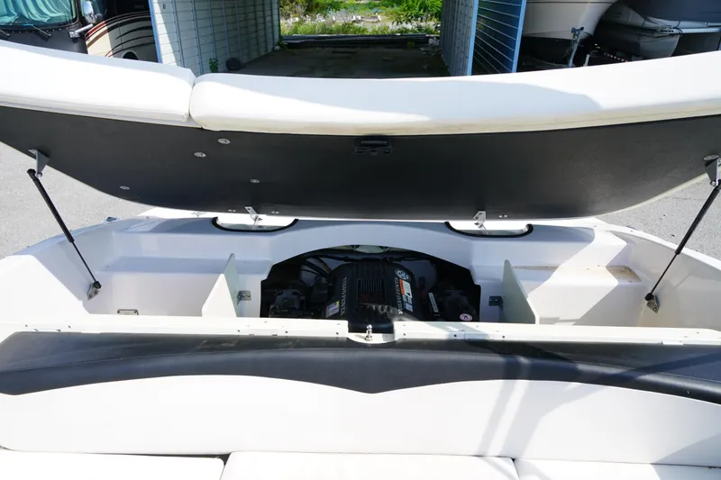 Slide: The Image of Open engine compartment of 2007 Four Winns 210 Horizon boat, showcasing interior details. - 15