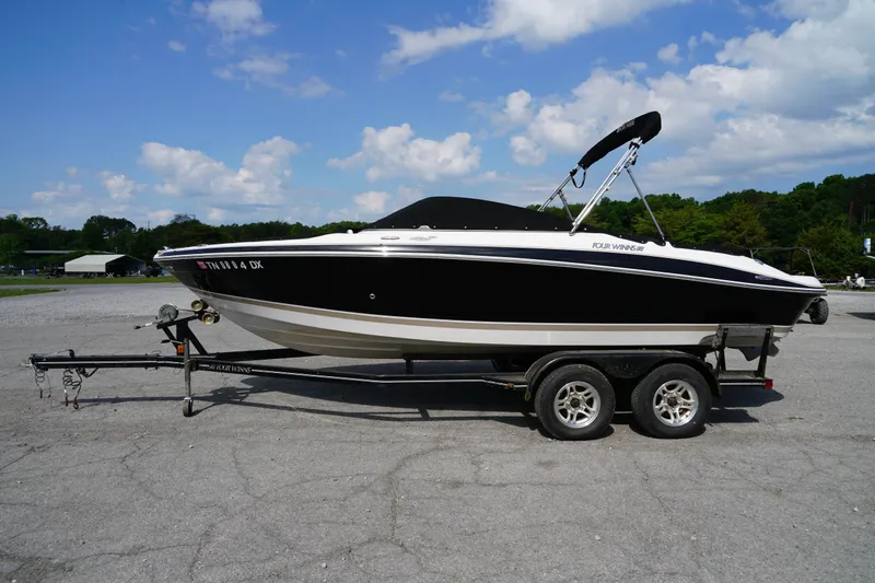 Slide: The Image of 2007 Four Winns 210 Horizon boat on trailer under blue sky. - 3