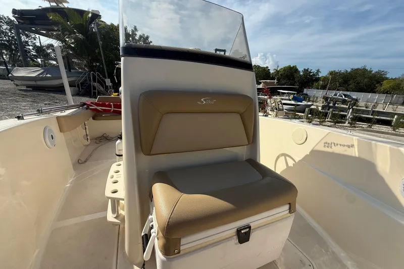 Slide: The Image of 2020 Scout 195 Sportfish boat interior with tan seating and console. - 2