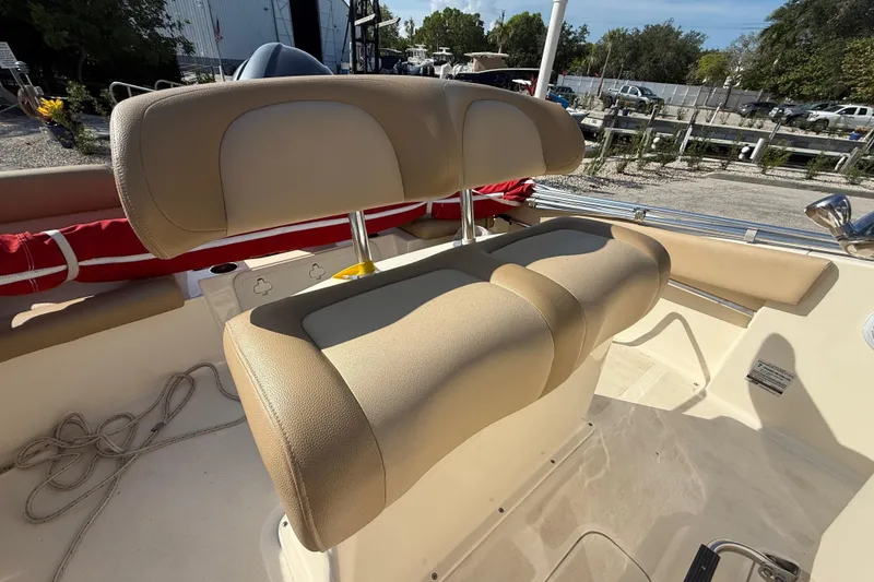 Slide: The Image of 2020 Scout 195 Sportfish boat with beige seating and deck details. - 4