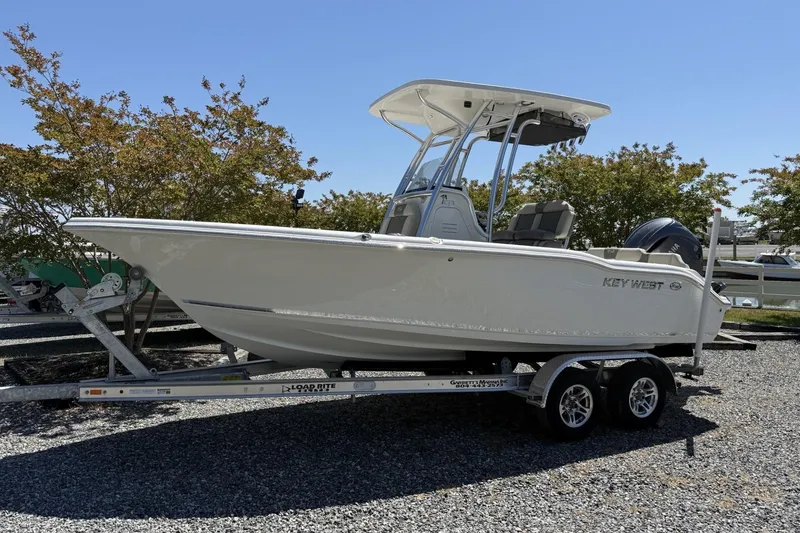 The Image of 2026 Key West 219 FS boat on trailer, parked outdoors. - 0