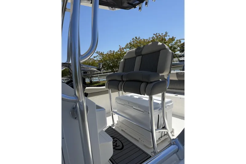 Slide: The Image of 2026 Key West 219 FS boat interior with cushioned seating and sleek design. - 2