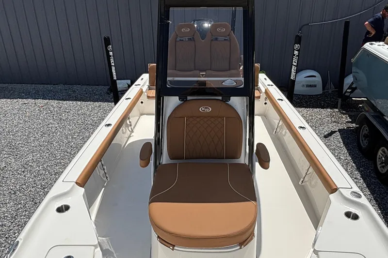 Slide: The Image of Key West 250 Bay Reef 2026 with brown leather seats. - 12