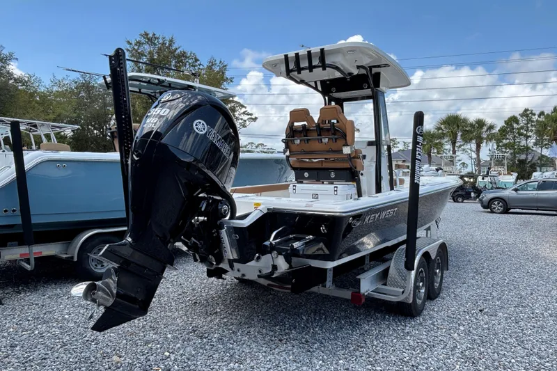 Slide: The Image of 2026 Key West 250 Bay Reef boat with Yamaha engine on trailer in outdoor setting. - 2