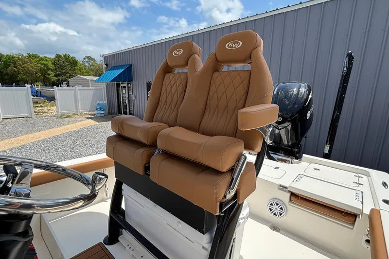 Slide: The Image of Luxurious seating on 2026 Key West 250 Bay Reef boat, featuring tan leather upholstery. - 7