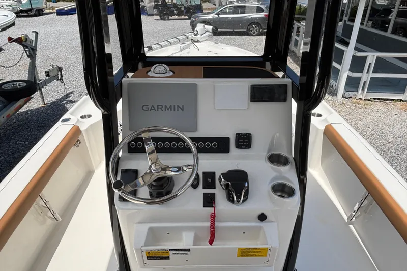 Slide: The Image of 2026 Key West 250 Bay Reef boat console with Garmin navigation system and steering wheel. - 8