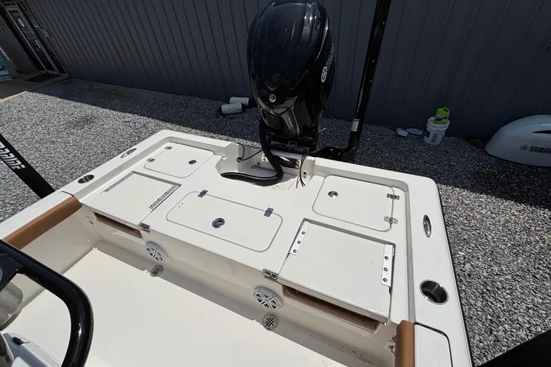 Slide: The Image of 2026 Key West 250 Bay Reef boat with Yamaha outboard motor, featuring storage compartments. - 9