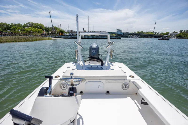 Slide: The Image of 2018 Bomb Island 160 SC boat on water, clear sky, and distant shoreline. - 14
